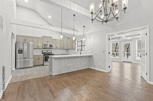 Luxury mansion kitchen with hanging lights and chandelier