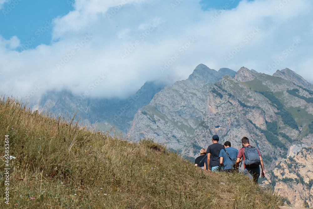 mountain landscape, a group of tourists goes to the mountains, travel, hiking, summer