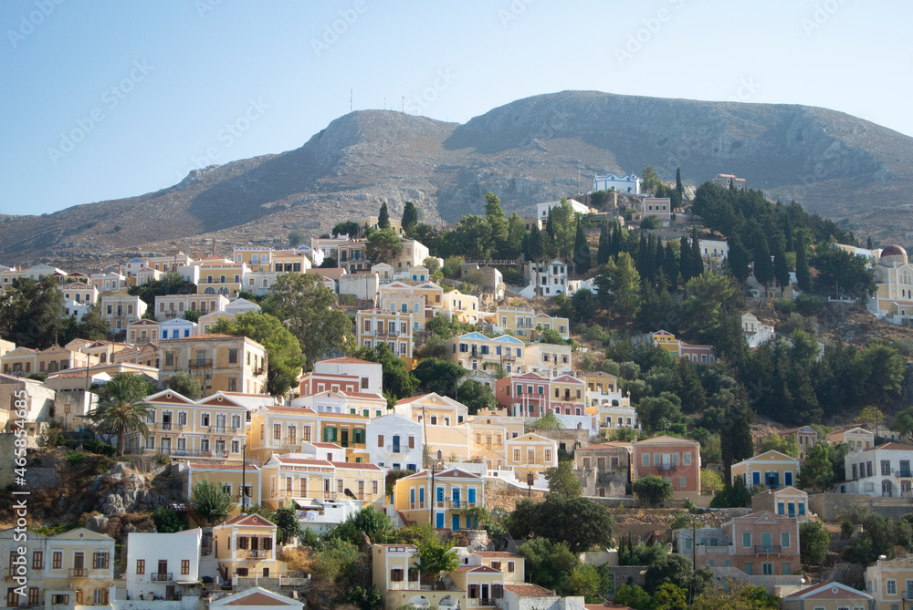 Beautiful Symi island, Greece. View of neo classical houses on a hillside.  Landscape view