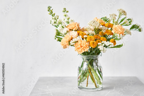 Finished flower arrangement in a vase for home. Flowers bunch  set for interior. Fresh cut flowers for decoration home. European floral shop. Delivery fresh cut flower.