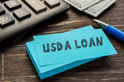 Financial concept about USDA LOAN United States Department of Agriculture with sign on the page.