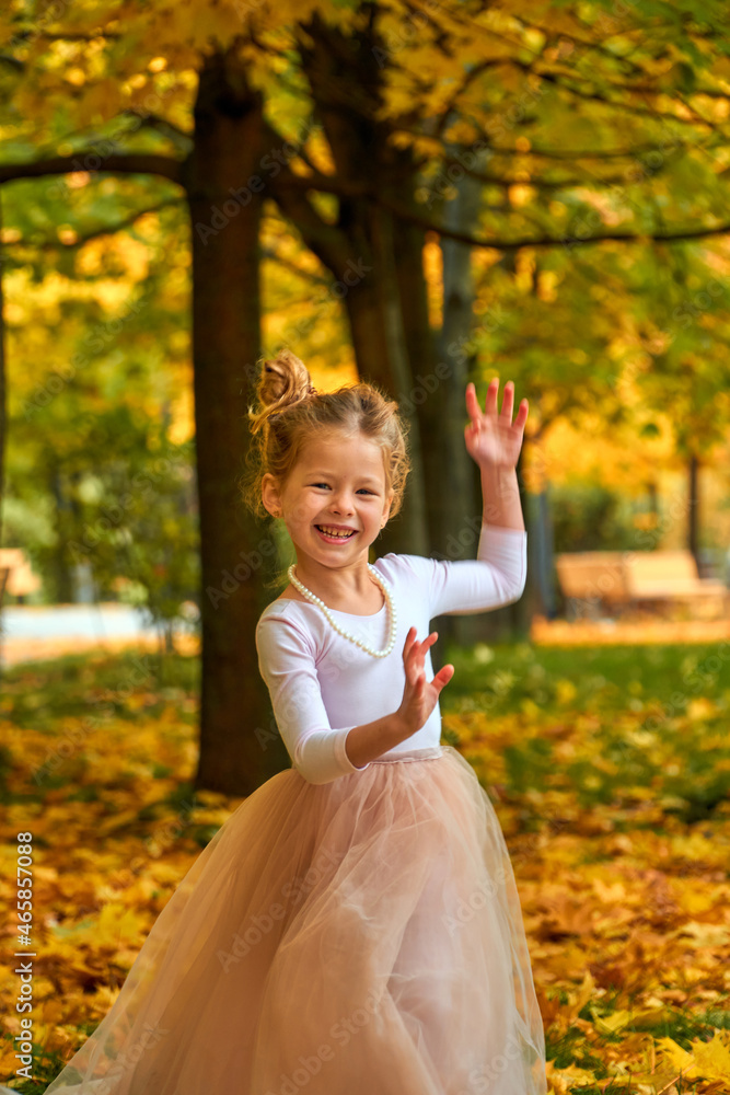 Little girl princess Selective focus in yellow autumn in fluffy skirt. Orange greens happy child playing outside. Fun outdoor play in new park new home. Childhood concept. Laughs smiles beautifully. Little girl princess Selective focus in yellow autumn in fluffy skirt. Orange greens happy child playing outside. Fun outdoor play in new park new home. Childhood concept. Laughs smiles beautifully.