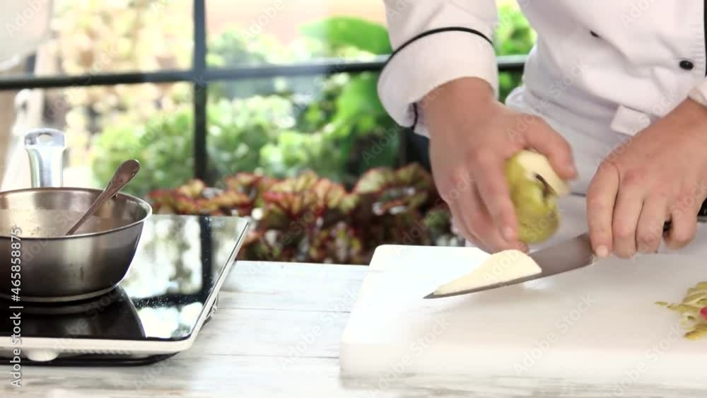 chef cutting pear hands holding knife and fruit cook a summer dish chef cutting pear hands holding knife and fruit cook a summer dish