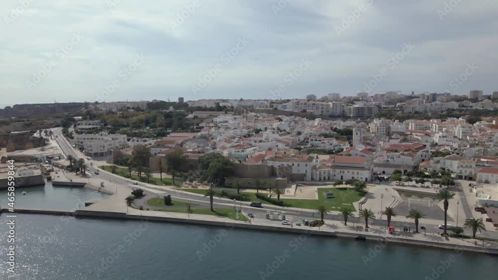 Aerial cityscape view of Lagos city and jetty, Algarve tourist destination region. Portugal. Aerial cityscape view of Lagos city and jetty, Algarve tourist destination region. Portugal.