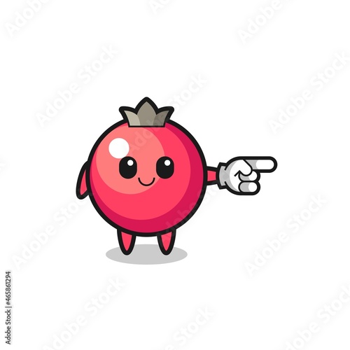 cranberry mascot with pointing right gesture