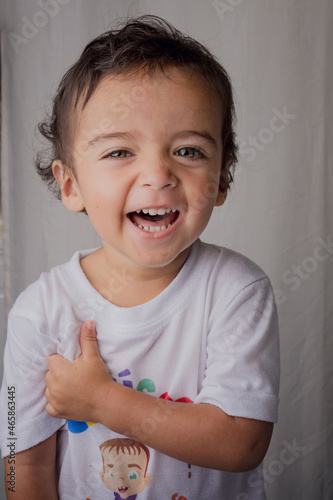 portrait of happy little boy laughing out loud