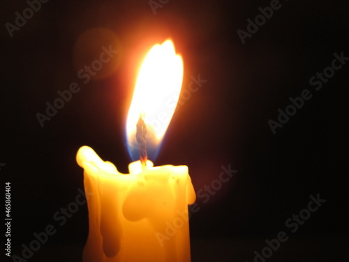 burning candle in the dark