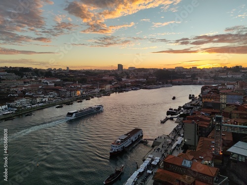 View over old town skyline and port, harbor at sunset on the Douro river at Porto, Portugal 