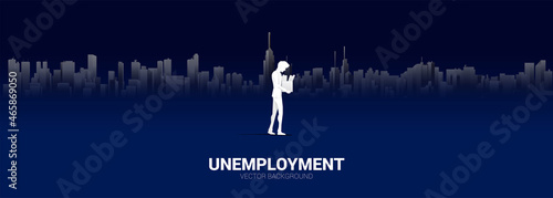 silhouette of losing job man walking with big city background. Concept for depression of unemployment people.