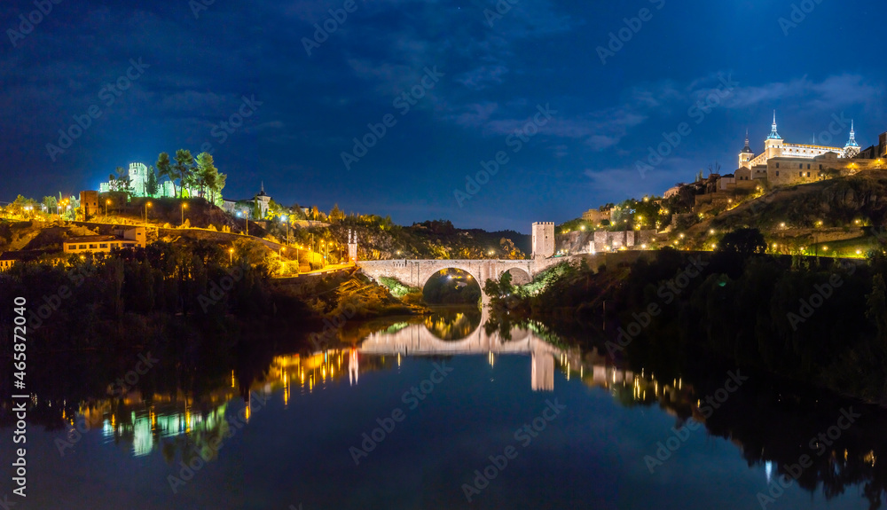 Night Panoramic view of the Alcázar de Toledo and the Castillo de San Servando across the Alcantara Bridge