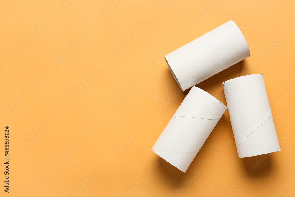 Empty toilet paper tubes on color background Empty toilet paper tubes on color background
