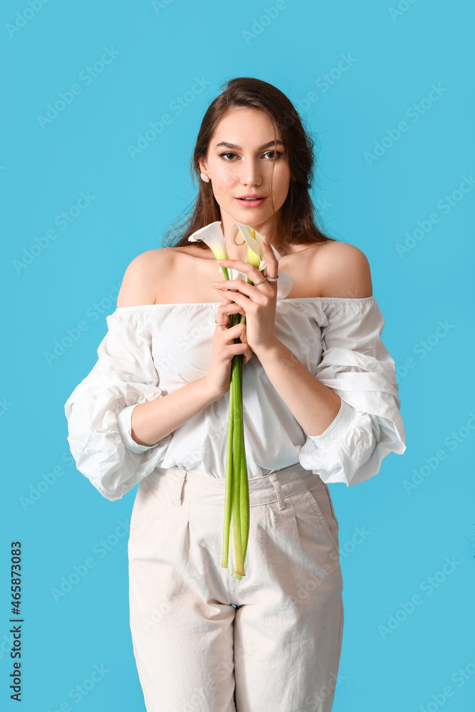 Beautiful young woman with calla flowers on color background Beautiful young woman with calla flowers on color background