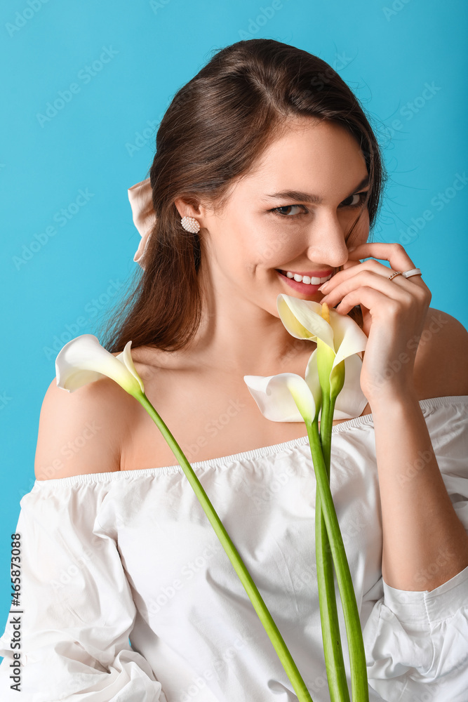 Beautiful young woman with calla flowers on color background Beautiful young woman with calla flowers on color background