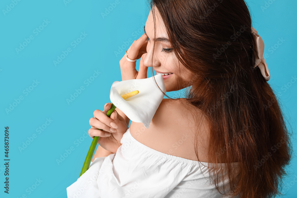 Beautiful young woman with calla flower on color background Beautiful young woman with calla flower on color background