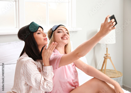 Beautiful young women takin...