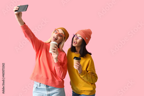 Cool young women taking sel...