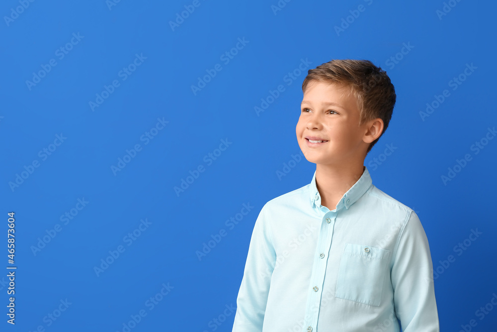 Smiling little boy in shirt on blue background Smiling little boy in shirt on blue background