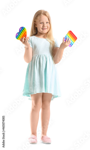 Pretty girl holding different pop it fidget toys on white background