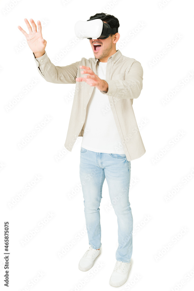 Full length of a man enjoying a videogame Full length of a man enjoying a videogame