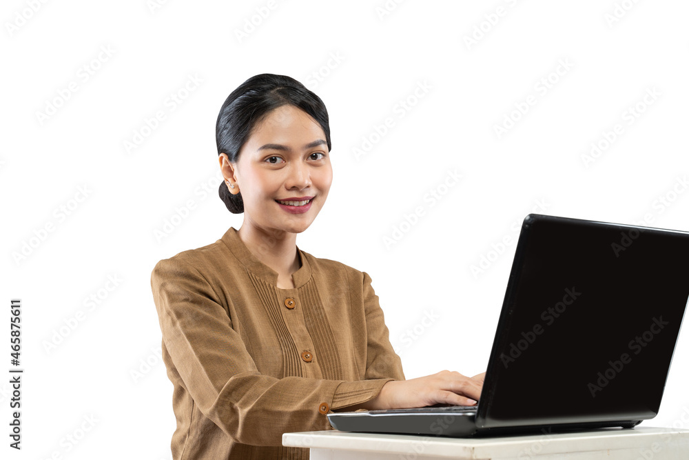 Smiling woman in civil servant uniform using laptop to work Smiling woman in civil servant uniform using laptop to work