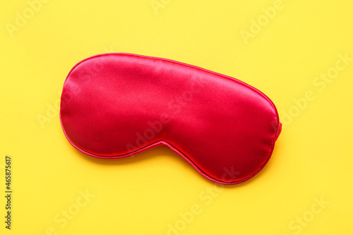 Stylish sleep mask on color background