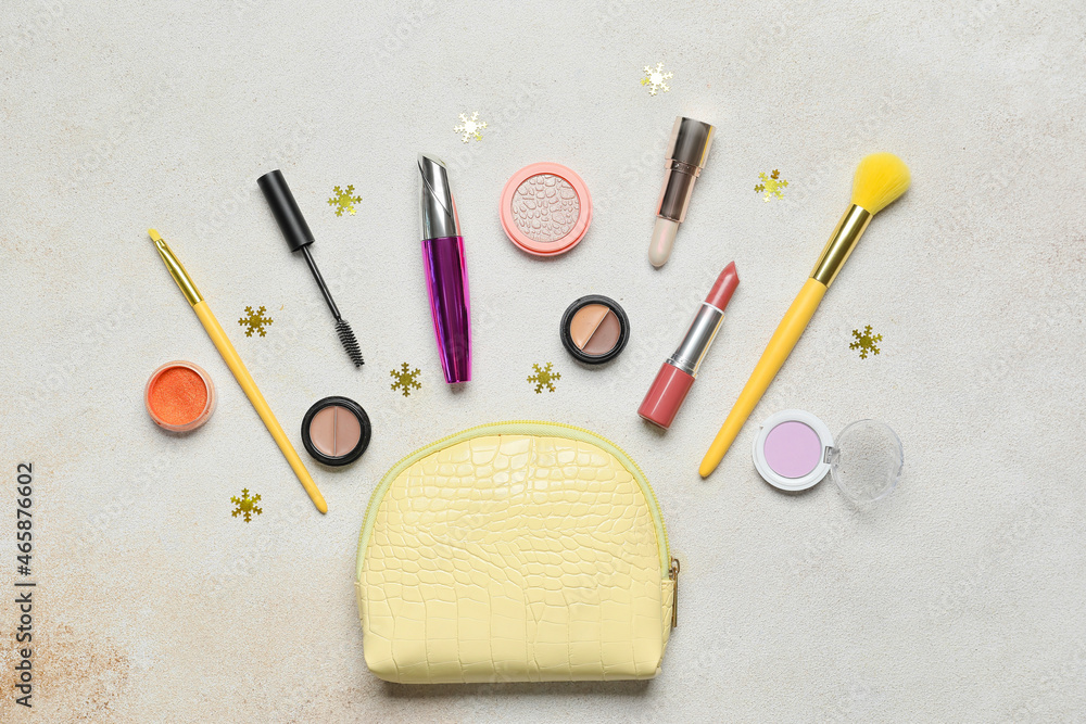 Makeup cosmetics with bag and Christmas decor on white background Makeup cosmetics with bag and Christmas decor on white background