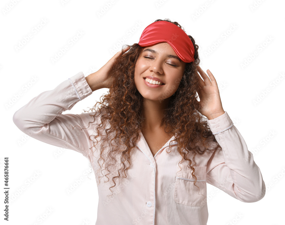 Young African-American woman with red sleeping mask on white background Young African-American woman with red sleeping mask on white background
