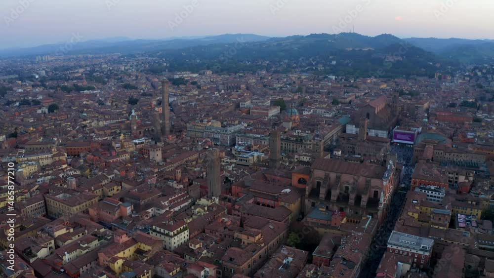 Bologna, Emilia-Romagna, Italy, October 2021. Drone slowly tracks north-west parallel with Medieval city center, while facing south-east at sunset. Bologna, Emilia-Romagna, Italy, October 2021. Drone slowly tracks north-west parallel with Medieval city center, while facing south-east at sunset.