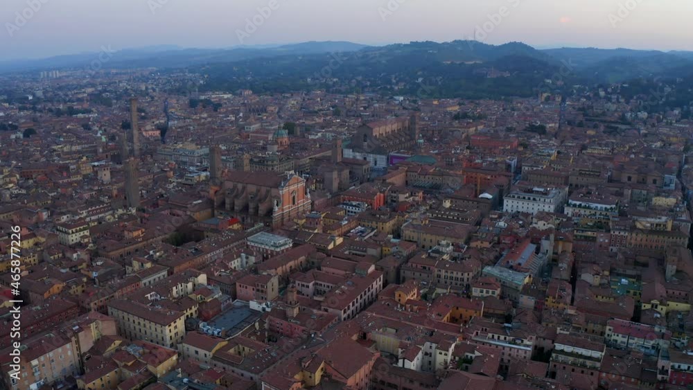 Bologna, Emilia-Romagna, Italy, October 2021. Drone slowly tracks from the northwest while facing southeast, slowly orbiting the historic Medieval city center at sunset. Bologna, Emilia-Romagna, Italy, October 2021. Drone slowly tracks from the northwest while facing southeast, slowly orbiting the historic Medieval city center at sunset.