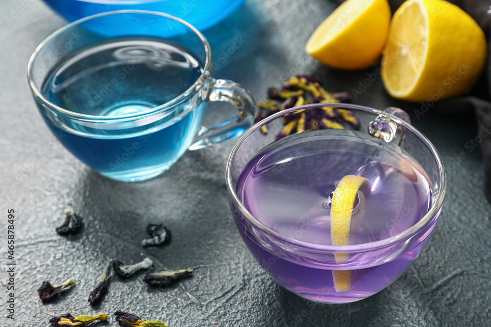 Cups of blue tea on dark color background Cups of blue tea on dark color background