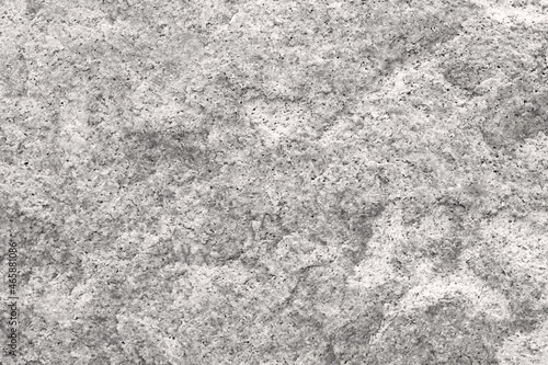 Texture and background of granite stone. granite is used for gravestones and memorials. Granite is a hard stone and requires skill to carve by hand.