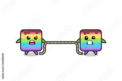 cute rainbow cake character is playing tug of war game