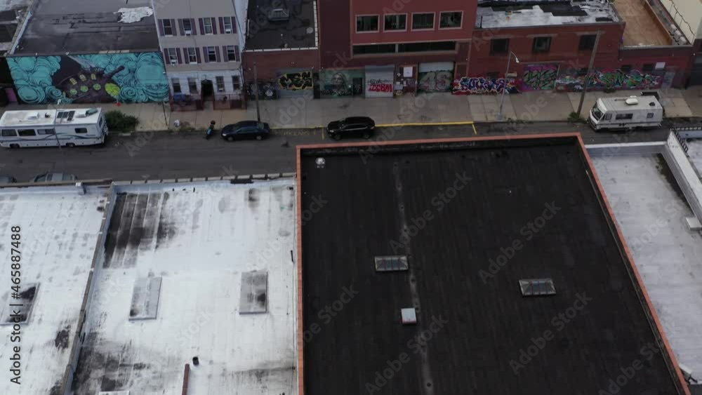 aerial flight and gradual tilt up over hip artist loft buildings in Bushwick Brooklyn NY aerial flight and gradual tilt up over hip artist loft buildings in Bushwick Brooklyn NY