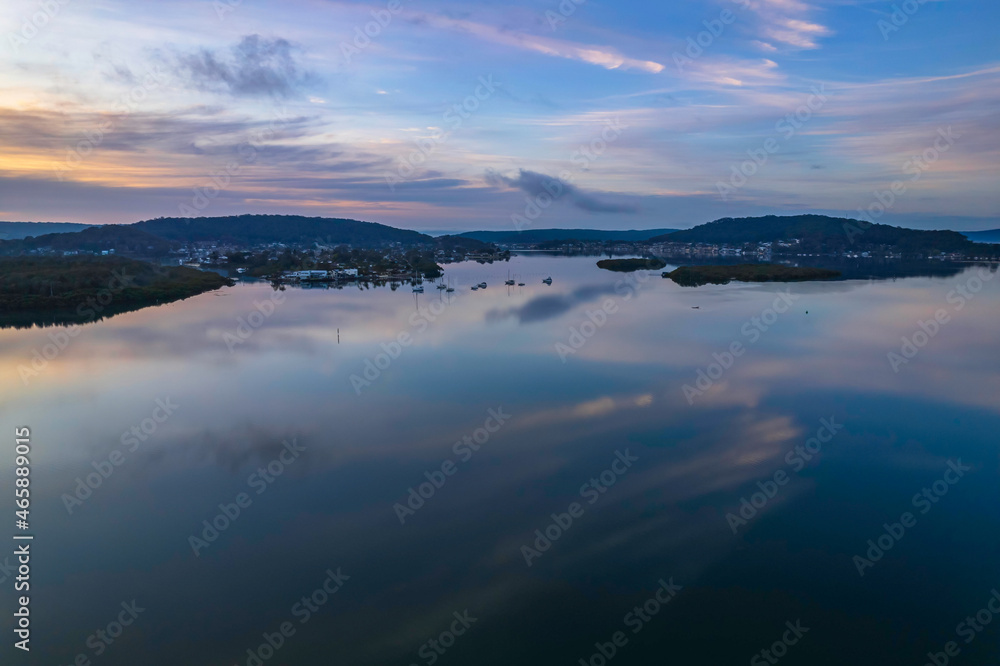 Sunrise and cloud reflections waterscape