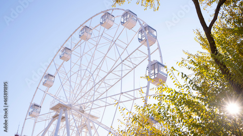Close-up.  A big wheel on a blue sky background. Selective focus.