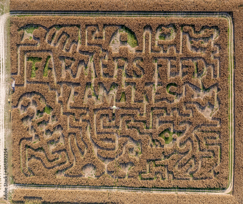 Aerial view of a Maryland corn maze labyrinth an American fall tradition before Halloween with farmers feed script