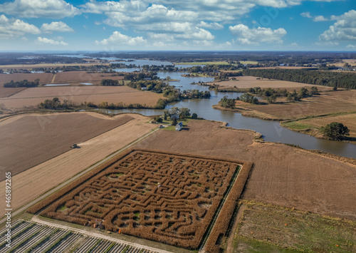 Aerial view of a Maryland corn maze labyrinth an American fall tradition before Halloween with farmers feed script with the choptank river in the background photo