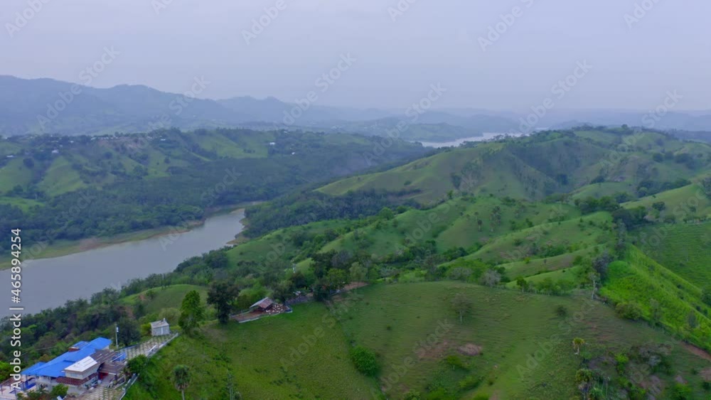 Aerial forward over green hills near Taveras dam in Dominican Republic Aerial forward over green hills near Taveras dam in Dominican Republic