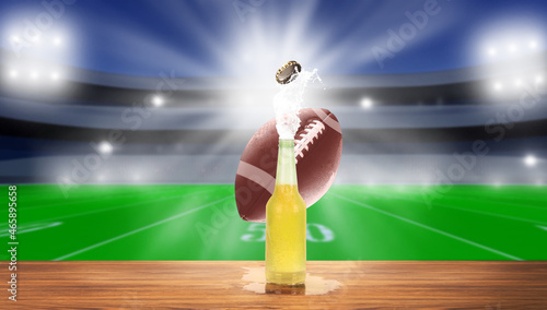 Light beer on a wooden table . TV broadcast of American football background. Sport bar concept
