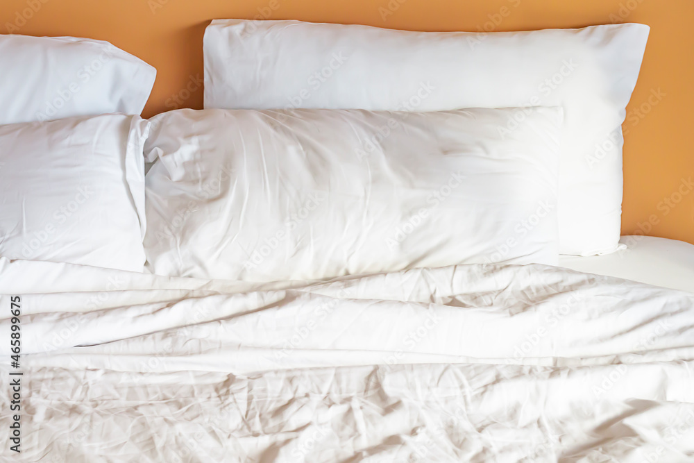 Mattress and white pillows in the bedroom with copy space. Mattress and white pillows in the bedroom with copy space.