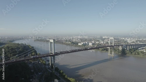 Vehicle traffic on Pont d'Aquitaine bridge in the city of Bordeaux France on the Garonne river, Aerial orbit shot photo