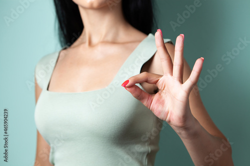 young woman showing ok gesture