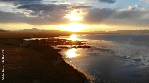 Kyrgyzstan. Sunset by the lake.