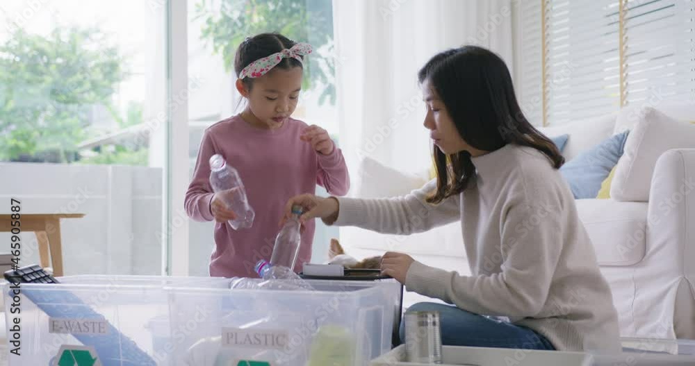 Mom teach Gen Z preteen girl kid dump paper glass can e-waste bag in reuse bin recycle bank help climate change social issue in asia people. Trash sorting clean eco green zero waste fun learn at home. Stock ビデオ | Adobe Stock