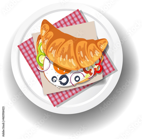 Breakfast croissant sandwich on white plate