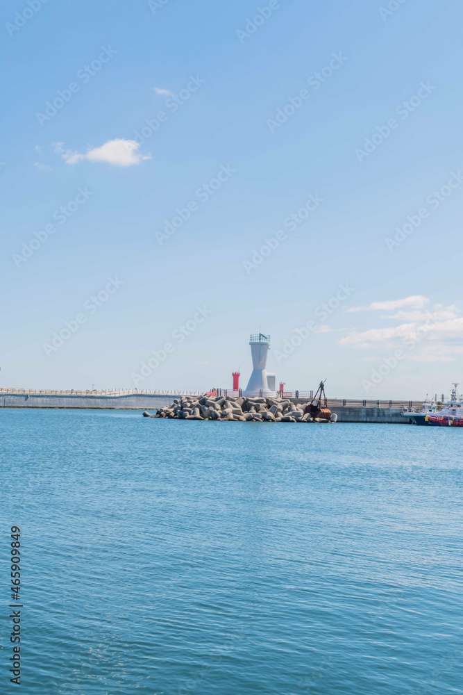 Seascape of Korean harbor with white lighthouse Seascape of Korean harbor with white lighthouse