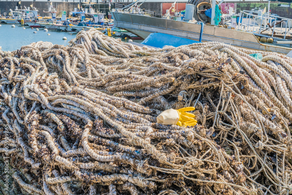 Coils of rope piled into cart