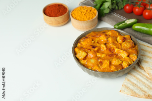 Concept of tasty food with chicken tikka on white background