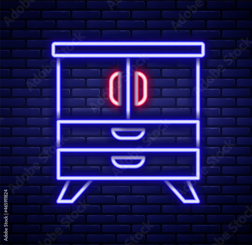 Glowing neon line Chest of drawers icon isolated on brick wall background. Colorful outline concept. Vector