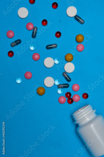 medicine jar vitamins capsules medicine blue background